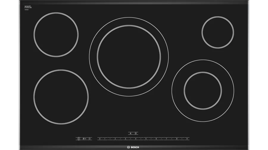 Cocina de vitrocerámica elegante y moderna en una cocina bien iluminada de Torrent, destacando su diseño liso y contemporáneo que facilita la cocción y limpieza.