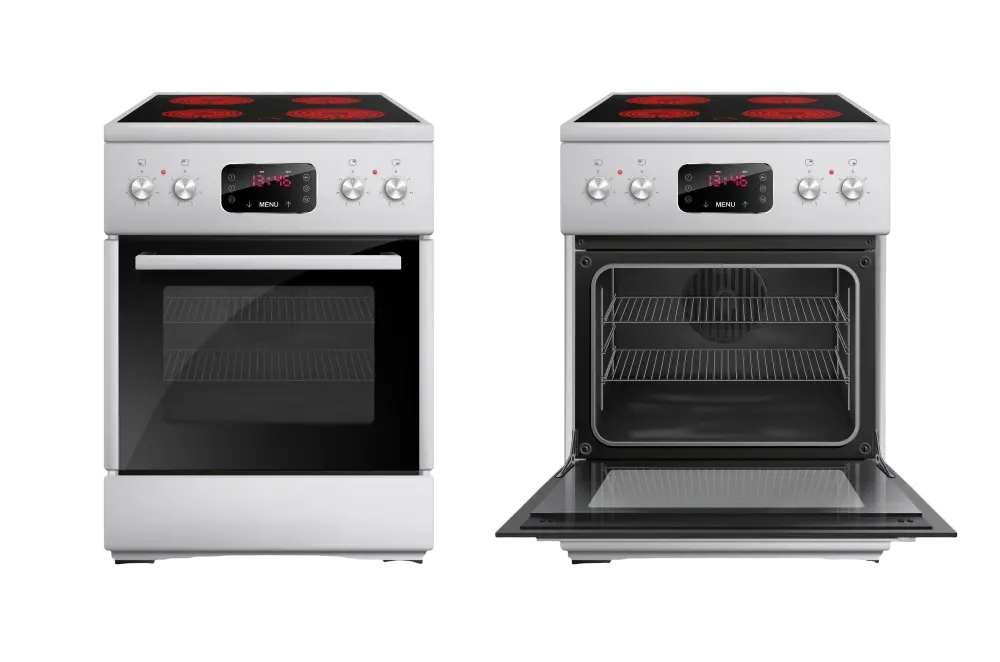 Técnico de mantenimiento reparando un horno en una cocina de Torrent, utilizando herramientas profesionales para garantizar la seguridad y eficiencia del electrodoméstico.